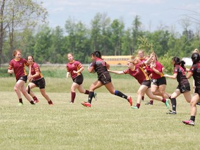 The Regi Panthers play Blessed Cardinal Newman in a consolation game at the OFSAA triple-A girls rugby championship in Ottawa on Wednesday. The Panthers lost 29-5. (Photo courtesy of OFSAA)