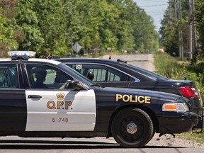 County of Brant OPP have First Line at Seneca Road on the Six Nations Reserve near Brantford, Ontario closed as they assist Six Nations Police on Wednesday June 1, 2016 following a shooting which left 3 people with undisclosed injuries. Brian Thompson/Brantford Expositor/Postmedia Network