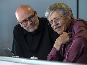 Toronto Sun baseball columnist and Kingston native Bob Elliott, right, talks with colleague Mike Rutsey in the press box at the Rogers Centre on Tuesday night. (Craig Robertson/Postmedia Network)