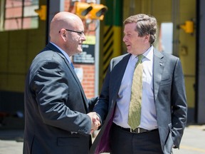 Ontario Transportation Minister Steven Del Duca, left, and Toronto Mayor John Tory at the TTC's Greenwood Yard Wednesday, June 1, 2016. (Ernest Doroszuk/Toronto Sun)