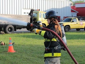 Eryn Morgan participates in the women's firefighter's challenge rally for a training session is pictured in this July 9, 2015 file photo in Ingleside, Ont. (Brent Holmes/Cornwall Standard-Freeholder/Postmedia Network)