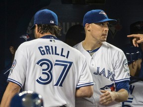 Blue Jays reliever Jason Grilli gets a high five from starter Aaron Sanchez during MLB action against the Yankees in Toronto on Wednesday, June 1, 2016. (Craig Robertson/Toronto Sun)