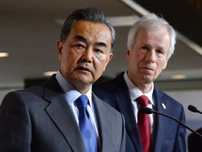 China's Minister of Foreign Affairs Wang Yi, left, and Canada's Minister of Foreign Affairs Stephane Dion participate in a press conference in Ottawa, on Wednesday, June 1, 2016. (THE CANADIAN PRESS/Justin Tang)