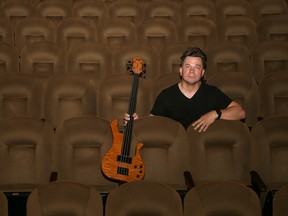 Tim Miller/The Intelligencer
Kris Tischbein sits on stage at the Empire Theatre in Belleville holding his signature instrument, the Hyperbass. Tischbein steps out of the traditional role of bass player as a back-up musician in a band to perform solo instrumentals.