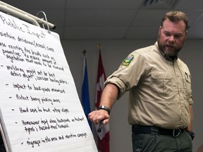 Wildfire prevention officer Michael Milner takes wildfire prevention treatment suggestions from Whitecourt residents. The FireSmart open forum was held at the Forestry Interpretive Centre on May 25, 2016 for homeowners that live in areas of high wildfire hazard. Hannah Lawson | Whitecourt Star