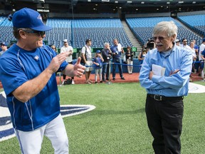 Jays manager John Gibbons shares a laugh with Bob Elliott on his final day at the ball park before retirement on June 1, 2016. (Craig Robertson/Toronto Sun)