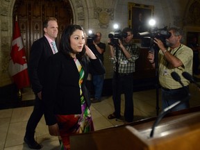 Minister of Democratic Institutions Maryam Monsef is joined by fellow MP Mark Holland, left, as they arrive to speak to reporters in the foyer of the house of commons on Parliament Hill in Ottawa on Thursday, June 2, 2016. THE CANADIAN PRESS/Sean Kilpatrick