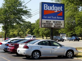 Rental cars are seen at a Budget car and truck rental franchise July 30, 2002. (Photo by Tim Boyle/Getty Images)