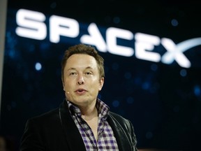 In this May 29, 2014, file photo, Elon Musk, CEO and CTO of SpaceX, introduces the SpaceX Dragon V2 spaceship at the SpaceX headquarters in Hawthorne, Calif. Musk predicted during an interview at the Code Conference in southern California on June 1, 2016, that people would be on Mars in 2025. (AP Photo/Jae C. Hong, File)