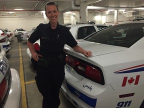 Const. Sandasha Bough stands in front of one of the London Police Service's multi-language cruisers. JENNIFER O'BRIEN/THE LONDON FREE PRESS