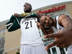 London Lightning basketball players Stephen Maxwell, left, and Akeem Scott hope their squad will be the second London sports team within two weeks to deliver a championship trophy to town as they head to Halifax to take on the Halifax Hurricanes in the NBL Canada championship series on Thursday.  The pair are pictured here outside their home arena, Budweiser Gardens, in London, Ont. on Tuesday May 31, 2016. Craig Glover/The London Free Press/Postmedia Network