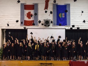 St. Jerome's Catholic School's graduating class of 2016 release their graduation caps, during their in-school graduation ceremony on Thursday, May 26. Taylor Hermiston/Vermilion Standard/Postmedia Network.