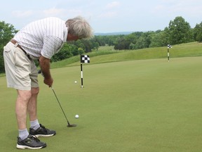 SAMANTHA REED/The Intelligencer    
Retired Belleville doctor Don Brearley practices his putting before the Dr. Mac Swing Fore Cancer Golf Tournament at Black Bear Ridge Golf course Thursday afternoon. The tournament raises funds for equipment at the Belleville General Hospitalís oncology clinic.