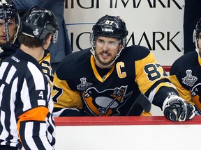 Pittsburgh Penguins captain Sidney Crosby speaks to official Wes McCauley during the first period in Game 2 of the Stanley Cup final between the Penguins and the San Jose Sharks in Pittsburgh on June 1, 2016. (AP Photo/Gene J. Puskar)
