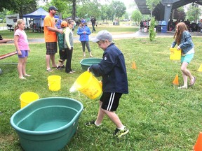 Students from Fairfield Elementary School take part in a water relay during the second annual Great Lake Water Festival in Lake Ontario Park in Kingston, Ont., on Thursday, June 2, 2016. The event was designed to promote a better understanding for the need for water protection and conservation. Michael Lea The Whig-Standard Postmedia Network
