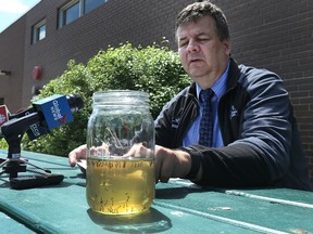 Ken Nowalsky, superintendent of insect control, addresses the media on summer nuisance mosquitoes at the city's insect control branch on Waverley Street in Winnipeg on Thu., June 2, 2016. The mason jar contains larvae from a scoop of ditch water.