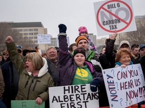 Julianne Tonney, middle, from Valley View, Alta. protested against Bill 6 in front of the Alberta Legislature building on Tuesday, March 8, 2016 - File photo.