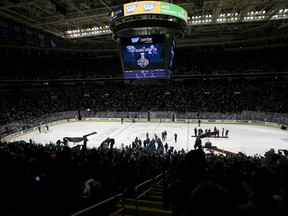 In this May 25, 2016 photo, fans at SAP Center at San Jose celebrate after the San Jose Sharks beat the St. Louis Blues 5-2 in Game 6 of the NHL hockey Stanley Cup Western Conference finals in San Jose, Calif. (AP Photo/Jeff Chiu)