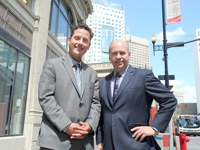 New president of the Winnipeg Chamber of Commerce, Loren Remillard (l) and outgoing president Dave Angus stand on Portage Avenue in Winnipeg, Man. Thursday June 02, 2016.