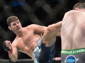 Michael Bisping (left) has fashioned a profitable UFC career as a flamboyant English bad boy, yet he had never been given a title fight after 25 trips to the octagon. Thanks to Chris Weidman's late injury, Bisping finally gets his long-awaited shot at middleweight champion Luke Rockhold's belt at UFC 199 on Saturday in Los Angeles. (Graham Hughes/AP Photo/Files)