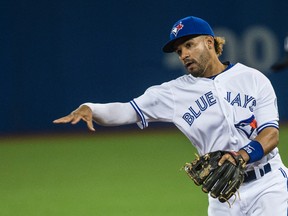 Blue Jays second baseman Devon Travis throws to first for the out during MLB action against the Yankees in Toronto on Wednesday, June 1, 2016. (Craig Robertson/Toronto Sun)