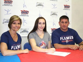 Serena Baker, centre, has accepted a full scholarship with the University of Illinois at Chicago Flames NCAA Division I women's gymnastics team. She has been trained by Bluewater Gymnastics Club Liz and Dave Brubaker. Terry Bridge/Sarnia Observer/Postmedia Network
