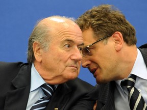 This file photo taken on May 31, 2009 shows then FIFA president Joseph Blatter (left) listening to Jerome Valcke, then secretary general of FIFA, during a press conference to announce the host cities for the 2014 FIFA World Cup in Nassau. (AFP PHOTO/JEWEL SAMAD)