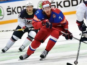 Ivan Telegin, seen here during the recent world hockey championships, will be staying in the KHL next season. (AFP FILE PHOTO/ALEXANDER NEMENOV)