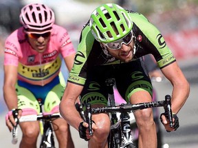 Ryder Hesjedal, right, crosses the finish line ahead of the overall leader Aberto Contador, left, at the end of the 18th stage of the Giro d’Italia from Melide, Switzerland, to Verbania, Italy, Thursday, May 28, 2015. (THE CANADIAN PRESS/AP, ANSA - Daniel Dal Zennaro)