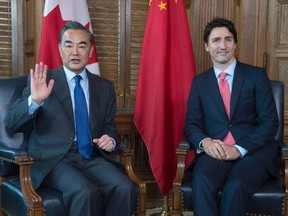 Prime Minister Justin Trudeau, right, meets with Chinese Foreign Minister Wang Yi on Parliament Hill in Ottawa, on June 1, 2016. (THE CANADIAN PRESS/Adrian Wyld)