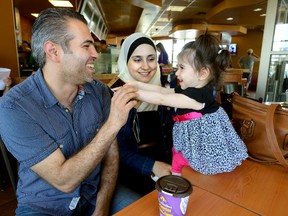 Syrian refugees Anas Tahhan and his wife Reem Nabhan with their one-year-old daughter Lana Tahhan in London, Ontario.
MORRIS LAMONT  / THE LONDON FREE PRESS / POSTMEDIA NETWORK