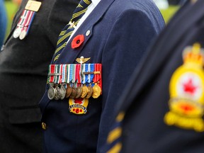 Medals hang on a Royal Canadian Legion member's chest in Madoc, Ont. Wednesday, Nov. 11, 2015. A few hundred people, including civilians, veterans, students and serving military staff, attended the Remembrance Day service. (Luke Hendry/Postmedia Network file photo)