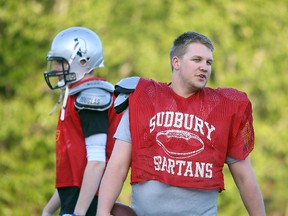 Sudbury Spartans quarterbacks Travis Campbell (foreground) and younger brother Aaron practise Wednesday for their season opener against the Tri-City Outlaws on Saturday. Game time is 7:30 p.m. Gino Donato/The Sudbury Star/Postmedia Network