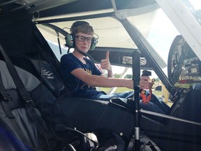 Student pilot Josh Binkley, 14, sits at the controls of an ultralight airplane at Norman Rogers Airport on Wednesday. Binkley made his first solo flight in April, two years before he can legally drive a car. (Elliot Ferguson/The Whig-Standard)