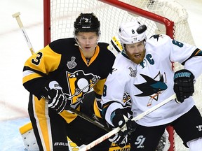 Olli Maatta of the Pittsburgh Penguins skates against Joe Pavelski of the San Jose Sharks during the first period in Game 2 of the Stanley Cup final at Consol Energy Center in Pittsburgh on June 1, 2016. (Matt Kincaid/Getty Images/AFP)