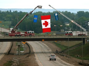 A bridge on Alberta Highway 63 at the south entrance to Fort McMurray welcomes residents back to their city on June 3, 2016. The entire Fort McMurray population of over 80,000 was forced to evacuate after a massive wildfire threatened to burn down Alberta's fourth largest city. (PHOTO BY LARRY WONG/POSTMEDIA NETWORK)