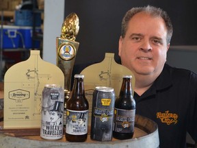 Railway City Brewing Company vice president of sales and marketing Paul Corriveau shows off some of the craft brewery's most recent awards. The St. Thomas beer maker took home a bronze medal for its Witty Traveller Belgian wheat brew and a gold for its Black Coal Stout at the 14th annual Canadian Brewing Awards in Vancouver last weekend.
