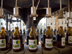 Vintage beer bottles on display at the Halve Maan Brewery in Bruges, Belgium on Thursday, May 26, 2016. The brewery has recently created a beer pipeline which will ship beer straight from the brewery to the bottling plant, two kilometers away, through underground pipes running between the two sources. (AP Photo/Virginia Mayo)