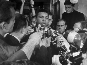 This file photo taken on April 29, 1967 in New York shows world heavweight boxing champion Muhammad Ali stating during a press conference that he refuses to go to the military service and fight in Vietnam.
(AFP Photo)