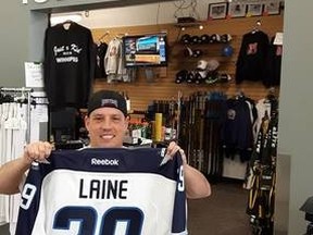 Patrik Laine isn't a Winnipeg Jet yet, but IceTime Sports co-owner Mike Wynne couldn't wait to get the Finnish star's name and number on a Jets jersey.