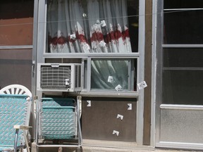 Bullet holes cover the door of a home on Blake St. in Toronto on June 4, 2016. A 10-year-old-boy was shot in the shoulder, but will survive, Toronto Police said. (Veronica Henri/Toronto Sun)
