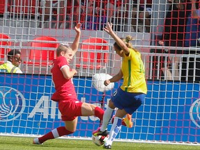 Brazil's Marta scores the opening goal against Canada on Saturday at BMO Field. (DAVE THOMAS/Toronto Sun)