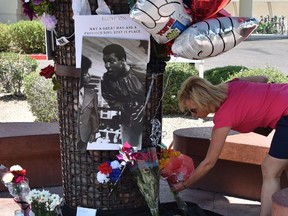 People pay homage outside the Scottsdale Healthcare Hospital where boxing legend Muhammad Ali passed away on eve in Scottsdale, Arizona. 
Heavyweight boxing legend Muhammad Ali an icon of the 20th Century whose fame transcended the sport during a remarkable career that spanned three decades died on June 3.