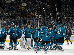 The San Jose Sharks celebrate after defeating the Pittsburgh Penguins in OT of Game 3 of the Stanley Cup final at SAP Center in San Jose on June 4, 2016. (Christian Petersen/Getty Images/AFP)