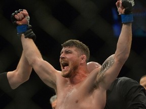 Michael Bisping reacts after defeating Luke Rockhold in their Middleweight Title Bout at UFC 199 at The Forum on June 4, 2016 in Inglewood, California.  Jayne Kamin-Oncea/Getty Images/AFP