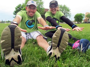 Troy Chandler and his sister, Kallie, stretch in preparation for a Troy's Trail annual Walk for Hydrocephalus and Spina Bifida, a fundraiser and vehicle for generating awareness about hydrocephalus, launched by Troy and his wife, Annette.  JEFFREY OUGLER/SAULT STAR