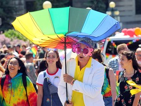 Participants march during the Gay Pride parade in Winnipeg, Man. Sunday June 5, 2016. (Brian Donogh/Winnipeg Sun/Postmedia Network)