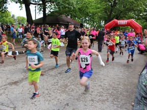 Matt Fecht, of Detroit, takes off with a pack of young runners at the YMCA-CHOK International Bridge Race Sunday. Children participated in a 1-kilometre fun run alongside the semi-professional runner who took the top title in the 10-kilometre race for the third year in a row Sunday. Barbara Simpson/Sarnia Observer/Postmedia Network