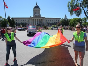 Participants carry the rainbow flag during the Pride parade in Winnipeg earlier this month. (Brian Donogh/Winnipeg Sun file photo)