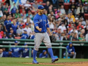 Toronto Blue Jays pitcher Marco Estrada celebrates after striking out Boston Red Sox's Mookie Betts to end the seventh inning at Fenway Park in Boston on June 5, 2016. (AP Photo/Steven Senne)